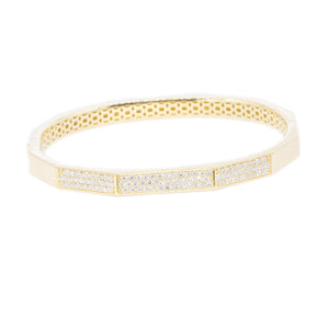 This easy to stack and style 18k yellow gold bangle features round ...