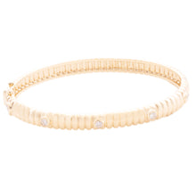 This easy to stack and style bangle features round brilliant cut di...