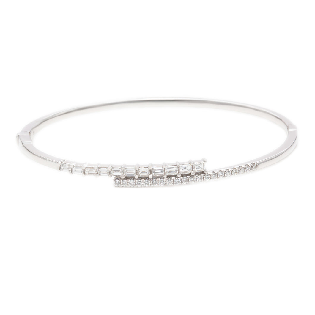 This gorgeous 18k white gold bangle features 20 round brilliant cut...