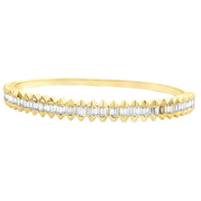 This beautiful 14k yellow gold bangle features 54 baguette cut diam...