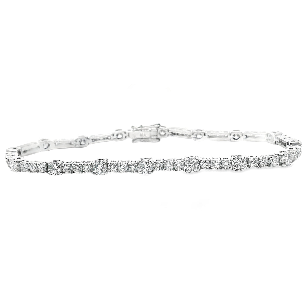 This beautiful 18k white gold bracelet features round brilliant cut...