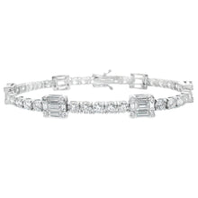 This beautiful 18k white gold diamond bracelet features baguette cu...