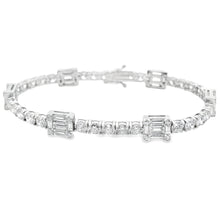 This beautiful 18k white gold diamond bracelet features baguette cu...