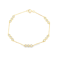This beautiful 18k gold bracelet features round brilliant cut diamo...