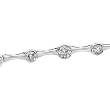 This 14k white gold diamond bracelet features 5 bezel-set round bri...