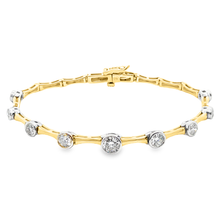 This 14k yellow/white gold diamond bracelet features 9 bezel-set ro...