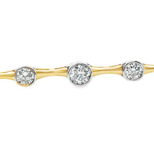 This 14k yellow/white gold diamond bracelet features 9 bezel-set ro...