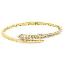 18k yellow gold cuff bangle features 56 round brilliant cut diamond...