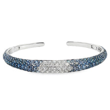 18k white gold cuff bangle features diamonds and sapphire stones. T...