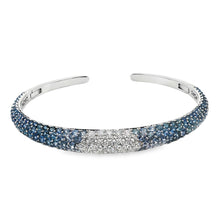 18k white gold cuff bangle features diamonds and sapphire stones. T...