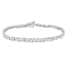This 18k white gold diamond bracelet features 98 baguette cut diamo...