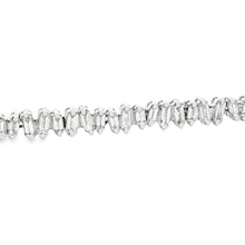 This 18k white gold diamond bracelet features 98 baguette cut diamo...