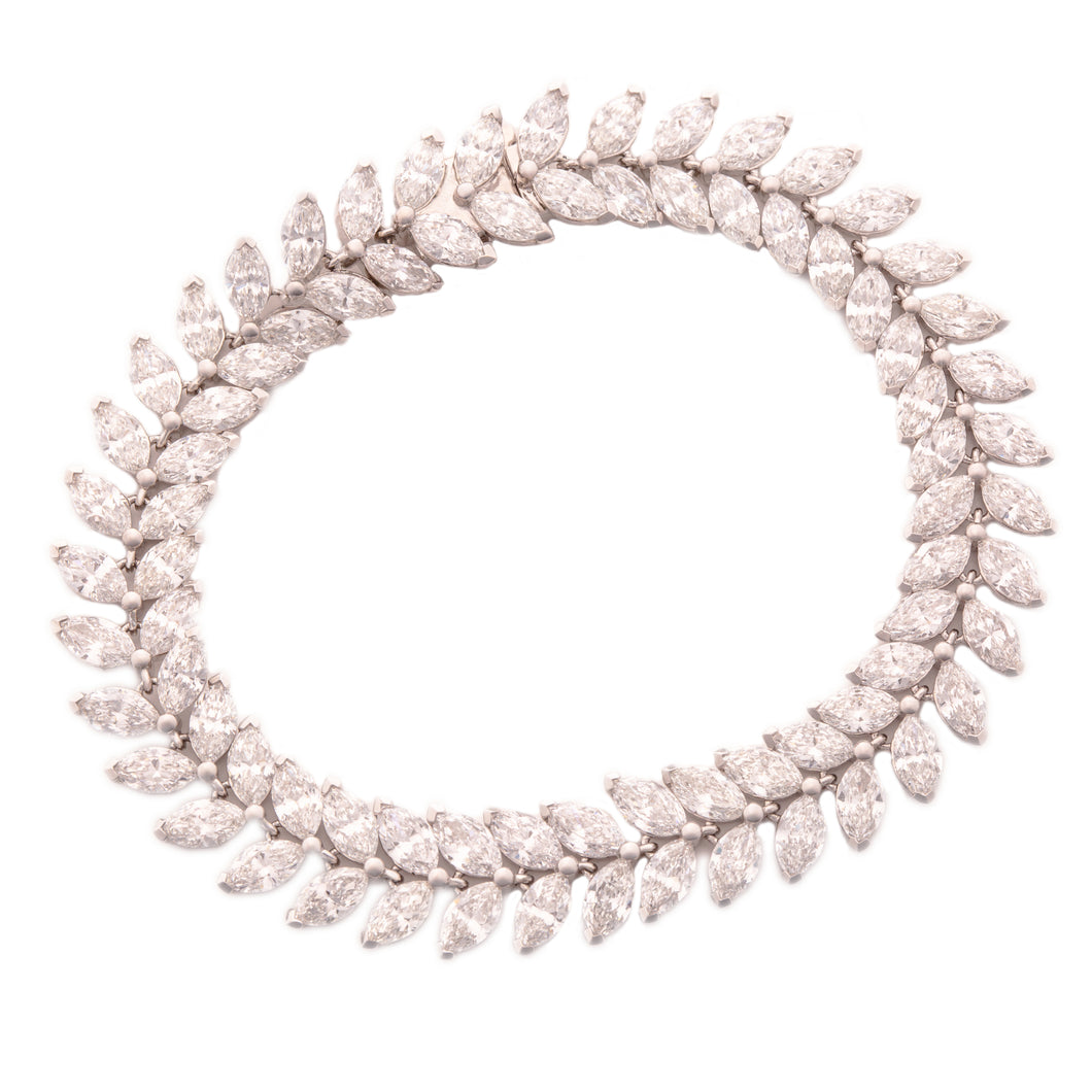 This 18k white gold diamond bracelet features marquise cut diamonds...