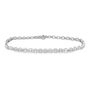 This beautiful 14k white gold diamond bracelet features emerald cut...