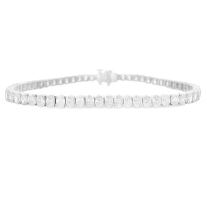 This 18k white gold diamond bracelet features 63 oval cut diamonds ...