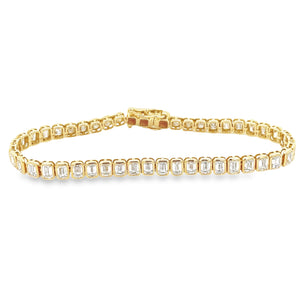 This beautiful 14k yellow gold bracelet features 47 emerald cut dia...