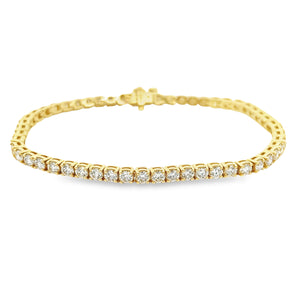 This easy to style 14k yellow gold bracelet features 54 round brill...