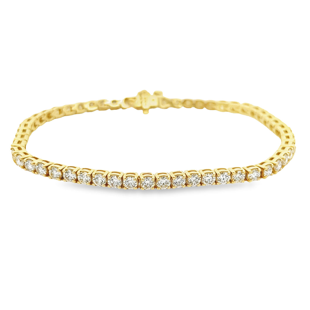 This easy to style 14k yellow gold bracelet features 54 round brill...