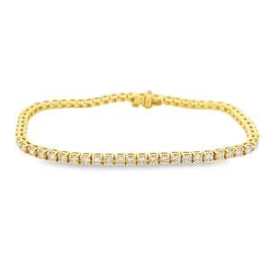 This easy to style 14k yellow gold bracelet features 63 round brill...