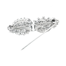 Estate piece: Platinum diamond brooch. Can be worn as a single broo...