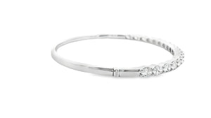 This easy to stack and style 18k white gold bangle features 18 oval...