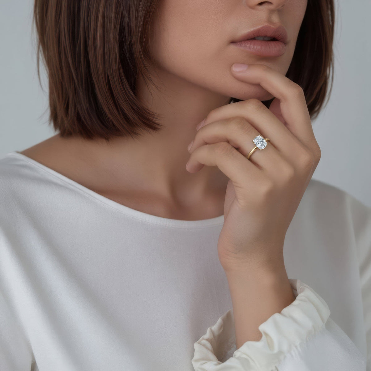 Elongated Cushion Cut Lab Grown Diamond Solitaire Engagement Ring in 14K yellow gold with 2.00ct center diamond worn on hand