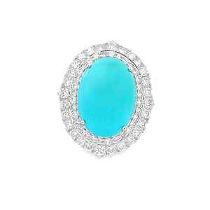 This gorgeous 18k white gold ring features a center turquoise stone...