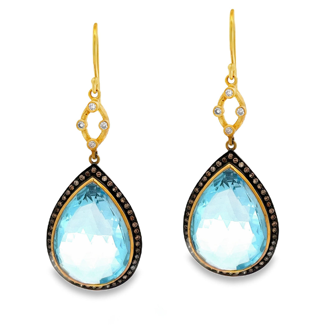 Estate piece: Yellow gold blue topaz and diamond drop earrings. 
Ea...