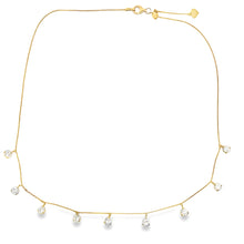 This beautiful 18k yellow gold necklace features 9 round brilliant ...