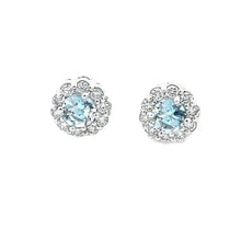 These 14k white gold diamond studs feature 2 aquamarines which are ...