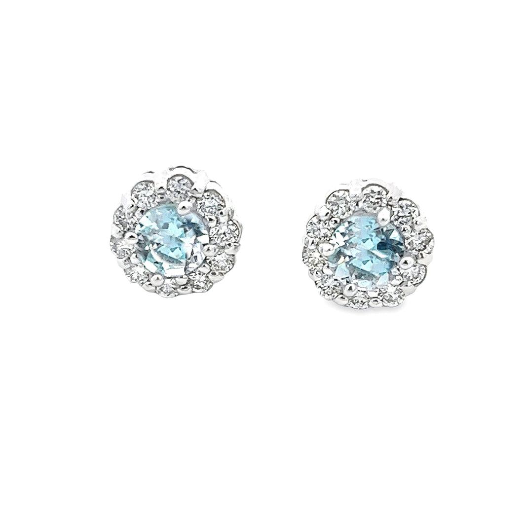 These 14k white gold diamond studs feature 2 aquamarines which are ...