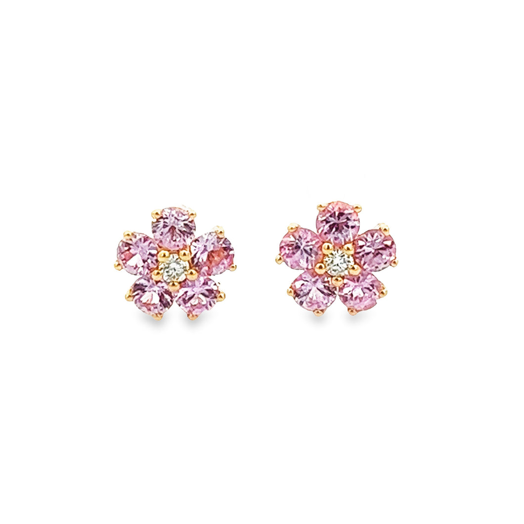 Dainty 14k yellow gold stud earrings feature pink sapphires as peta...