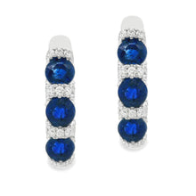 These beautiful 18k white gold huggy earrings feature 88 round bril...