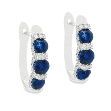 These beautiful 18k white gold huggy earrings feature 88 round bril...
