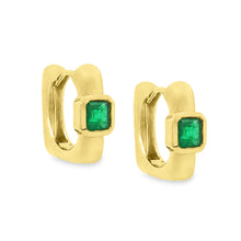 These beautiful 18k yellow gold huggy earrings feature 2 emeralds. ...