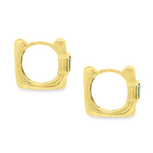 These beautiful 18k yellow gold huggy earrings feature 2 emeralds. ...