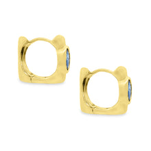 These beautiful 18k yellow gold huggy earrings feature 2 oval cut s...