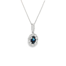 This gorgeous 18k white gold pendant features a sapphire that weigh...