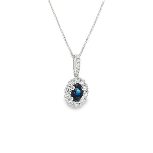 This gorgeous 18k white gold pendant features a sapphire that weigh...