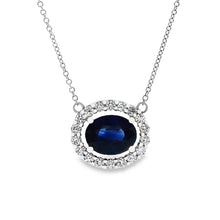This beautiful 18k white gold pendant features 1 oval cut sapphire ...