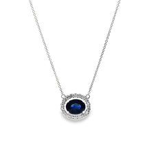 This beautiful 18k white gold pendant features 1 oval cut sapphire ...