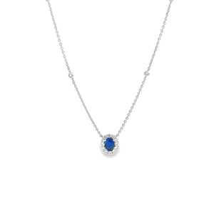 This 18k white gold necklace features a beautiful sapphire that wei...