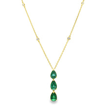 This beautiful 18k yellow gold pendant features 3 emeralds and 4 ro...