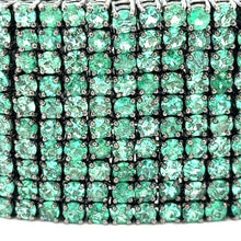 This show-stopper bracelet features green emeralds set in sterling ...