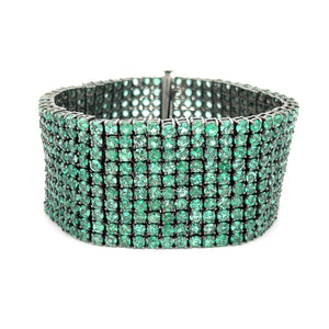This show-stopper bracelet features green emeralds set in sterling ...