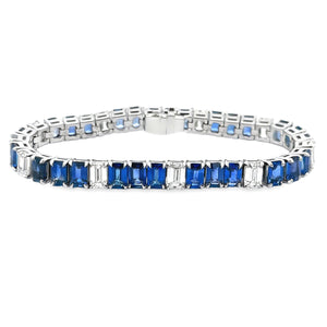 This gorgeous platinum bracelet features 11 emerald cut diamonds to...