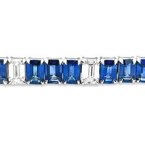 This gorgeous platinum bracelet features 11 emerald cut diamonds to...