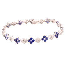 This beautiful 18k white gold bracelet features alternating sapphir...