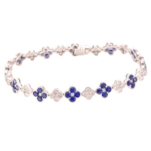 This beautiful 18k white gold bracelet features alternating sapphir...