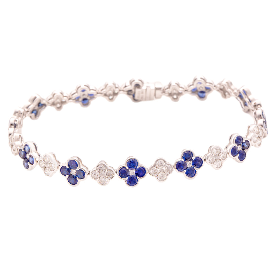 This beautiful 18k white gold bracelet features alternating sapphir...